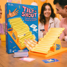 Load image into Gallery viewer, Tilt 'n Shout game set with packaging on a table, people laughing and playing in the background