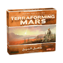 Load image into Gallery viewer, Board game box for 'Terraforming Mars' with mars landscape and astronaut illustration.