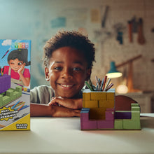 Load image into Gallery viewer, Child with a toy construction set and educational materials in a classroom setting