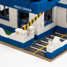 Load image into Gallery viewer, Model police station made from interlocking bricks with a barrier gate.