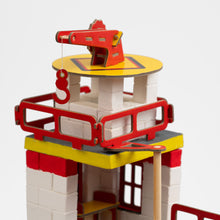 Load image into Gallery viewer, Toy construction set with red, yellow, and white colors on a light gray background