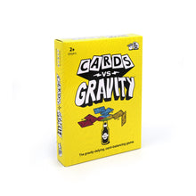 Load image into Gallery viewer, Yellow box of 'Cards vs. Gravity' game on a white background
