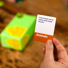Load image into Gallery viewer, Hand holding a card from the game Dumb Questions To Ask Your Friends with text &#39;If the Guesser was an animal, what would they be?&#39; and &#39;Animals&#39; on a blurred background.
