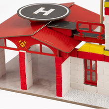 Load image into Gallery viewer, Model fire station with red roof and white walls on a white background
