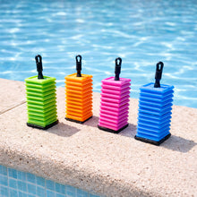 Load image into Gallery viewer, Ok play colorful tiles on a pool ledge with water in the background
